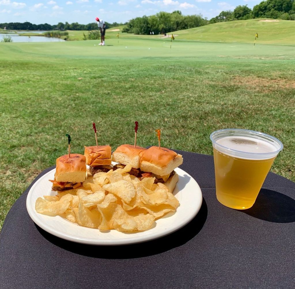 A lunch of sliders,chips and beer outside on the course